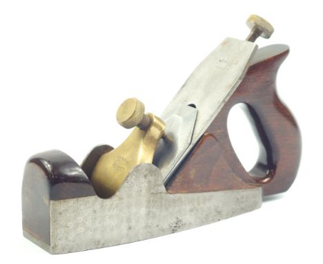 A Norris of London A5 dovetail coffin smoothing plane, with engine turned sides and stained beech handle.