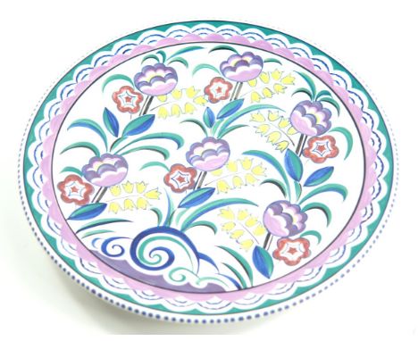 A Poole Pottery charger, traditionally painted with flowers, by Susan Russell, painted and printed marks, 35cm diameter.