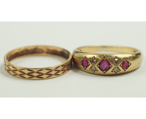 A 9ct  gold and ruby three stone gypsy ring, set with pairs of diamond chips at intervals, size R, 9ct gold wedding band, siz