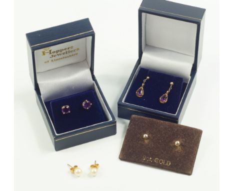 A pair of 9ct gold and amethyst earrings, a pair of 9ct gold and amethyst drop earrings, a pair of 9ct gold stud earrings, an