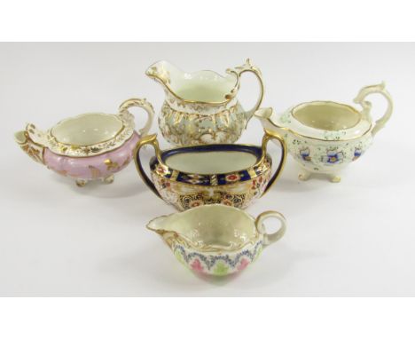 A Ridgways early 19thC porcelain cream jug, reserve painted with flowers against a grey and gilt floral ground, two cream jug
