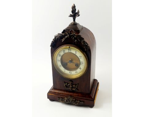 A French late 19thC walnut and brass mounted mantel clock, circular brass dial with enamel chapter ring bearing Arabic numera