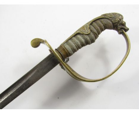 A German WWI Imperial Navy sword for Herbert Winterhalder, brass embossed guard, wire bound shagreen grip and lion's head pom