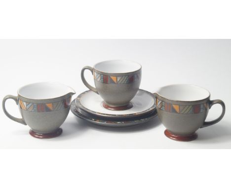 A Denby Pottery part tea service decorated in the Aztec pattern, comprising a pair of cream jugs, pair of sugar bowls, bread 