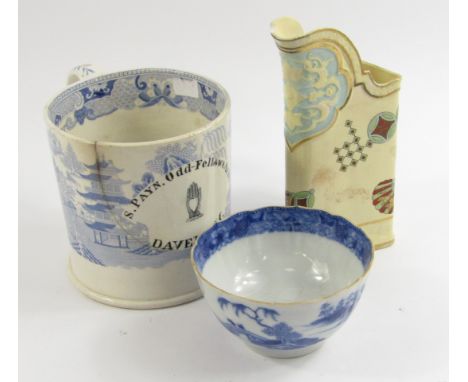 An early 19thC blue and white tankard, transfer decorated in the Willow pattern, oval reserve painted, S Payn, Odd-Fellows Ar