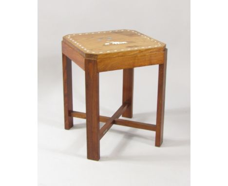 A 1930's Indian teak occasional table, inlaid with wood, ivory and mother of pearl showing elephants and treen, raised on rec