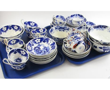 A group of Hilditch early 19thC blue and white tea wares, some clobbered, comprising three slop bowls, sugar bowl, seventeen 