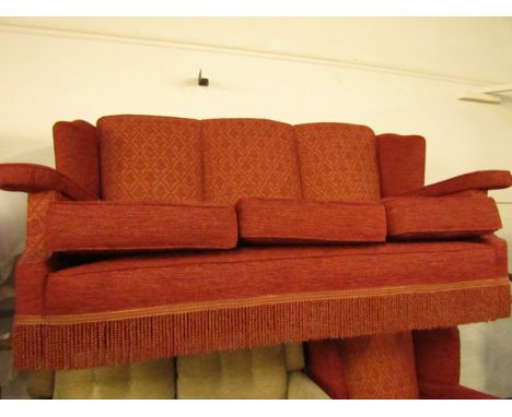 A Harrods wing back three seater sofa and armchair, re-upholstered in red 'Chatsworth' fabric.