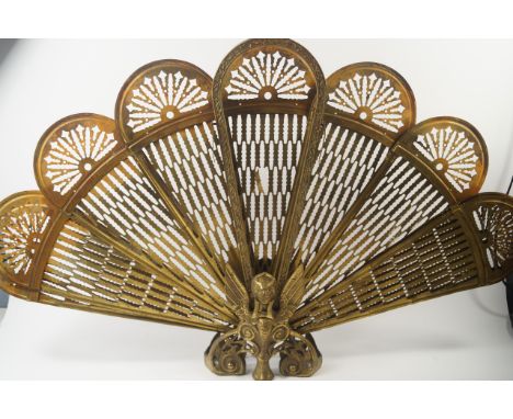 A brass phoenix fan shaped fire screen, 58cm high.