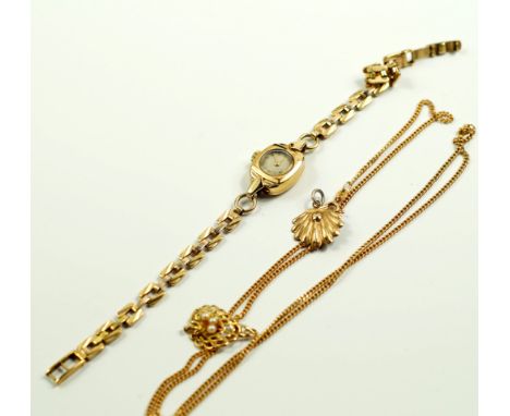 A 9ct gold curb link neck chain, two 9ct gold and seed pearl set pendants, 6.9g, and a lady's 9ct gold wristwatch on strap, 1