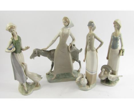 A Lladro porcelain figure of a girl with a goat, 28cm high, another of a girl with geese, 28cm high, and two further Spanish 