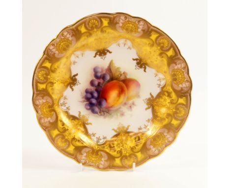 A Royal Worcester porcelain cabinet plate painted by R Sebright with fruit, circa 1911, within a pink, yellow and gilt floral