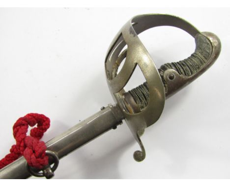 A German WWI cavalry sword for Ernest Winterhalder, steel guard and wire bound black shagreen grip, engraved steel blade bear