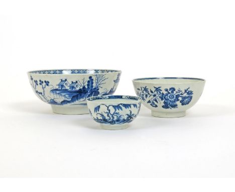 Three Worcester blue and white bowls, c.1770, a punch bowl painted with pagodas and a bridge in The Precipice pattern, open c