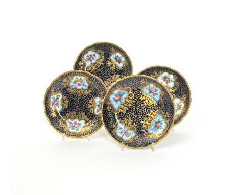 Four Russian (St Petersburg) porcelain plates, late 19th century, painted with four panels of flowers within gilt floral cart
