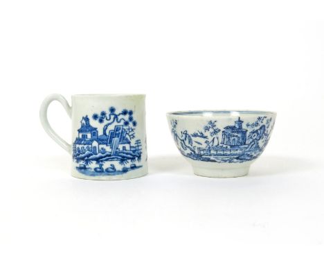 A Lowestoft blue and white teabowl, c.1770, printed with a figure standing on a bridge before a pagoda on a small island, a f