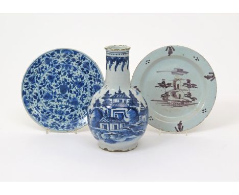 A Dutch Delft bottle vase or guglet, 18th century, painted in blue with a tall pagoda and other smaller dwellings in a tree-l