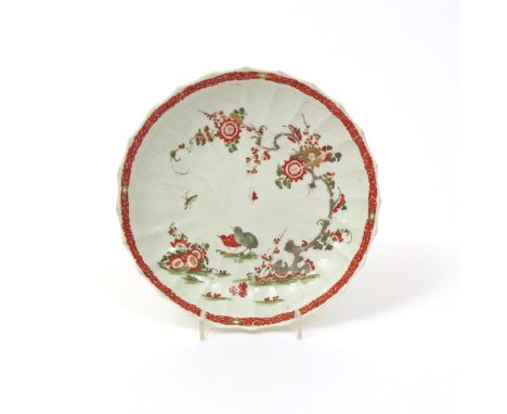 An unusual fluted Worcester plate, c.1770-75, decorated probably outside of the factory with the Kakiemon Two Quail pattern, 
