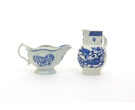 A Worcester strap-moulded sauceboat, c.1770-80, painted with the Strap Flute Sauceboat Floral pattern, and a small cabbage le