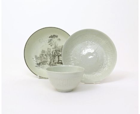 A Philip Christian (LIverpool) teabowl and saucer, c.1765, moulded with small flower sprays over a band of narrow fluting, an