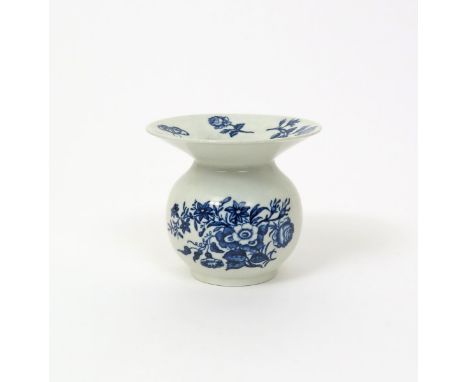 A Worcester blue and white spittoon, c.1770-75, printed with the Three Flowers pattern, the wide rim with single stems of ros