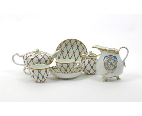 A Vienna part tea service, late 18th century, decorated with a trellis pattern of green leaves intersected by pink roses, wit