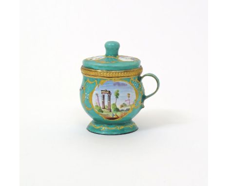 A South Staffordshire enamel custard cup and cover, c.1770, of squat baluster shape, painted with panels of figures beneath t