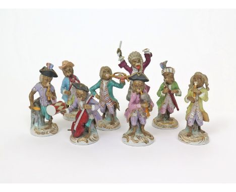 An eight-piece Continental porcelain monkey band (Affankapelle), 19th century, typically modelled wearing colourful costumes,