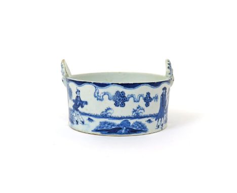 A Bow blue and white buttertub, c.1760, painted with the Golfer and Caddy pattern of two figures beneath curly prunus branche