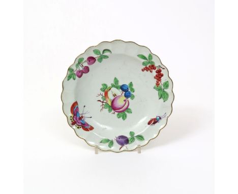 A small Worcester scallop-edged plate, c.1768-70, decorated in the atelier of James Giles, the well with a small spray of fru