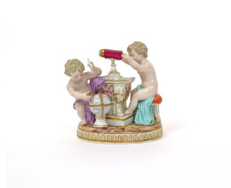 A Meissen figure group emblematic of Astronomy, late 19th century, after the model by M V Acier, modelled as two putti, one l