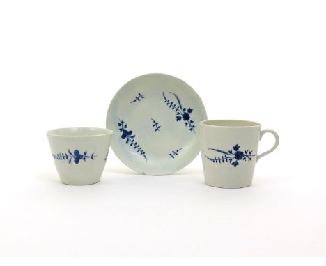 An English porcelain blue and white trio, c.1780, probably Worcester, of a flared beaker, coffee cup and saucer, decorated in