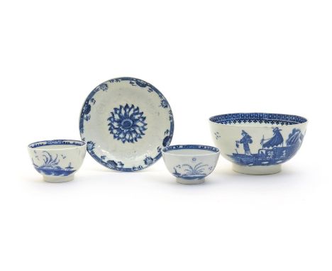 A pair of Caughley blue and white teabowls, c.1780, painted with the Island pattern, a moulded Caughley saucer printed with a