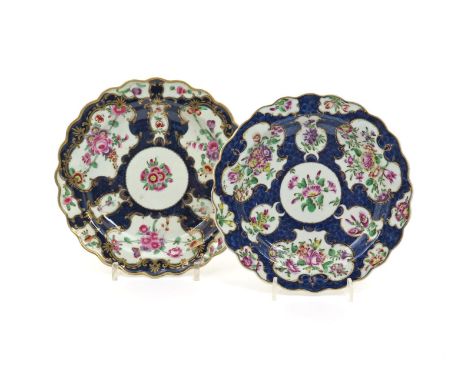 Two Worcester scallop-edged plates, c.1770-75, painted with various floral garlands and single sprigs of fuchsia, heartsease 