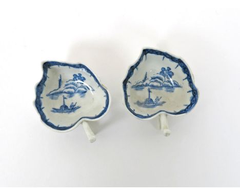 A pair of English porcelain blue and white butterboats, c.1770, Worcester or Caughley, the interior of the leaf-shapes printe