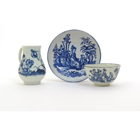 A Worcester blue and white sparrowbeak cream jug, c.1765, painted with the Bird in a Ring pattern, and a matched teabowl and 