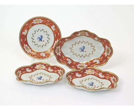 Four Chamberlain's Worcester armorial dishes, c.1825, the wells decorated with the crest of the upper half of a blue seahorse