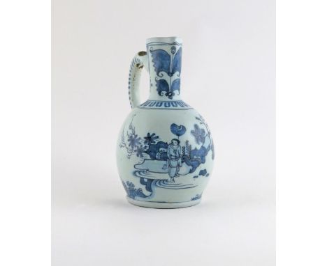 A Delft jug, c.1680, painted with Chinese figures in garden settings, the handle with scroll and dash motifs, 20cm.