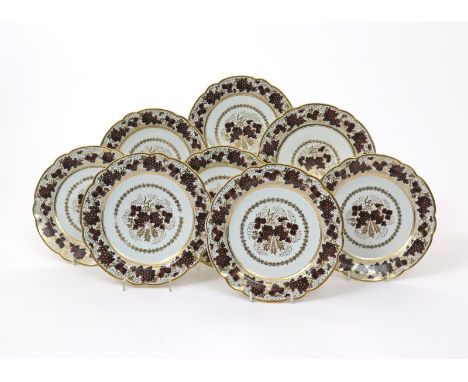 A set of eight Barr Worcester dessert plates, c.1800, painted with sepia bunches of grapes on gilt vine tendrils, incised B m