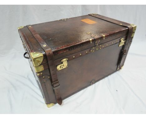 A Large Army and Navy Leather covered Trunk