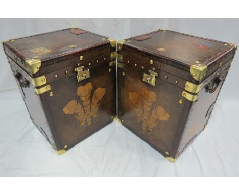 A Pair of Army and Navy Leather Trunks