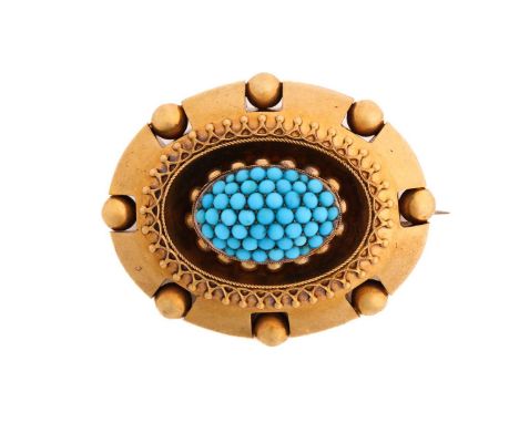 An Etruscan style turquoise brooch, comprises a central oval form boss encrusted with bead set round blue turquoise cabochons