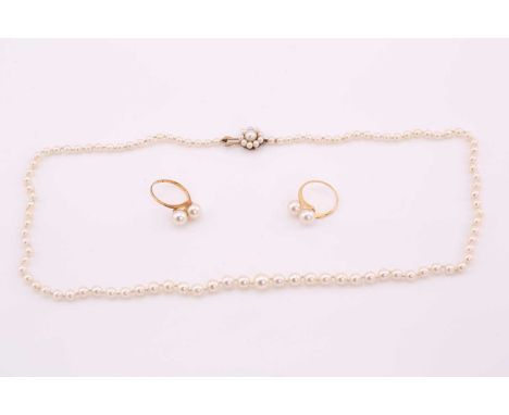 Two rings each with two pearls and a pearl necklace, consisting of two matching rings, with two pearls approximately measurin