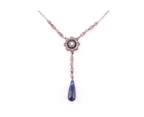 A silver drop necklace with blue and white stones, consisting of a target pendant and a sodalite drop, on a 38 cm cable chain