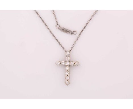 A Tiffany &amp; Co. diamond cross necklace, consisting of eleven round brilliant diamonds of an estimated total weight 0.44ct