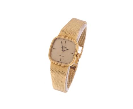 A lady's Omega wristwatch, with a hand-wound Swiss-made movement caliber 663, in an 18ct yellow gold cushion-shaped case meas