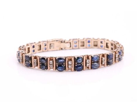 A sapphire and white stone bracelet, comprises graduated sized hinged links, with alternating single-cut sapphires and white 