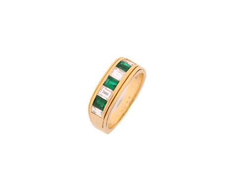 A diamond and emerald half eternity ring, comprises three step-cut emeralds measuring 3.9 x 3.1 mm, alternating with four ste