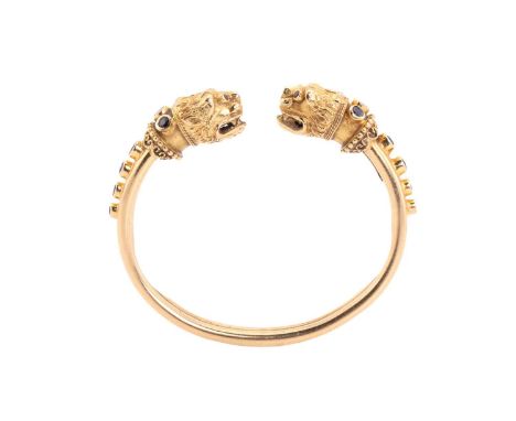 A LALAoUNIS gem-set torque bangle, from Greek designer Ilias Lalaounis, sculpted with two Byzantine-styled lion heads in yell