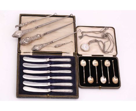 A cased set of six silver seal top spoons, Birmingham 1939; together with a set of silver handled tea knives, four silver han